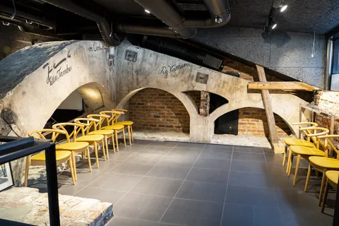 The arches of LYHTY with its yellow chairs