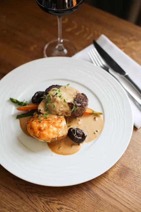 Oobu's classic cognac and pepper steak with gratinated baked potato