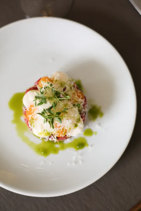 Beef tartare with egg yolk crème, pickled onion and truffle mayonnaise