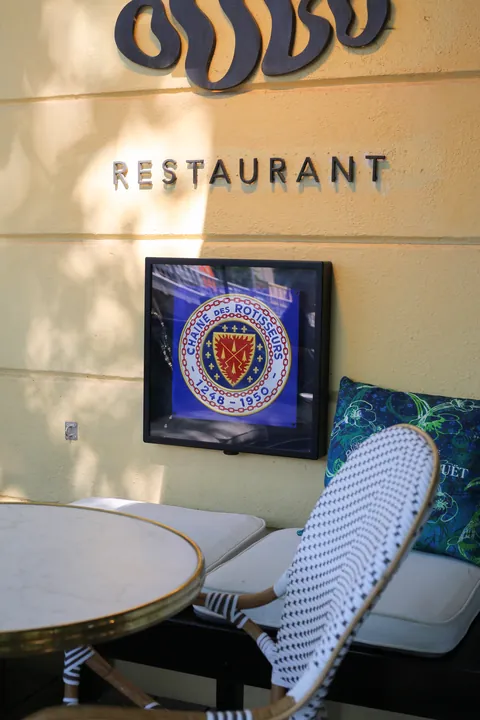 The OOBU RESTAURANT sign in the entrance hall beside the Blazon of Chaîne des Rôtisseurs